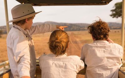 Children watching elephants during a family safari in Tanzania